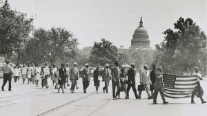 Group of African-Americans, marching near the Capitol building in Washington, D.C., to protest the lynching of four African-Americans in Georgia